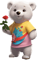 a teddy bear wearing a yellow shirt with roses on it holds a red rose