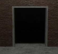 a dark room with a brick wall and a doorway leading to it .