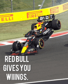 a red bull race car is going around a track