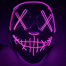 a purple light up mask with stitches on the mouth