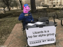 a man is sitting at a table with a sign that says `` litzards is a top tier alpha group ``