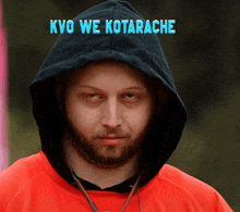 a man wearing a black hoodie with the words kyo we kotarache on the top