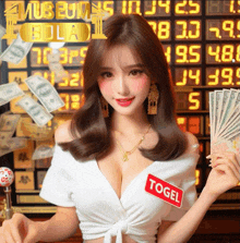 a woman wearing a white top with a red sticker that says ' togel ' on it