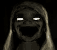 a black and white photo of a scary girl with glowing eyes and mouth .