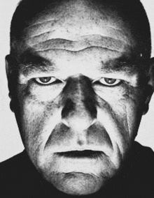 a black and white photo of an angry man