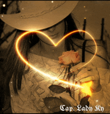 a woman in a cowboy hat is holding a rose and a heart shaped glowing object