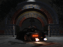 a car is parked in front of a brick archway