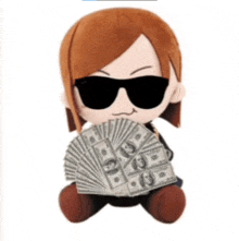 a stuffed animal with sunglasses on holding a fan of money