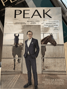 a man in a suit is on the cover of a magazine titled the peak