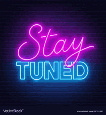 a neon sign that says " stay tuned " on a brick wall