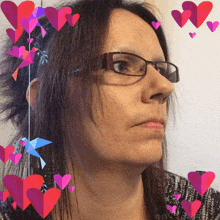 a woman wearing glasses is surrounded by hearts and a hummingbird