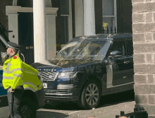 a range rover is parked in front of a building