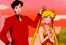 a man in a red suit is standing next to a girl with her eyes closed