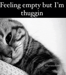 a black and white photo of a cat with the words feeling empty but i 'm thuggin