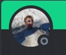 a blurry picture of a man in a blue jacket in a circle .