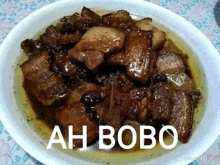 a plate of food with the words ah bobo written on it .