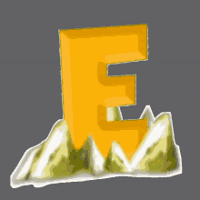 a yellow letter e is sitting on top of a hill