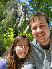 a man and a girl are posing for a picture