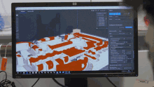 a hp computer monitor shows a 3d model of a building