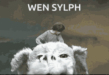 a person riding on the back of a white dog with the words wen sylph written above them