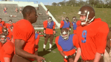 a group of football players are standing on a field and one of them has the number 9 on his shirt