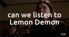 a woman covering her mouth with her hand and the words " can we listen to lemon demon "