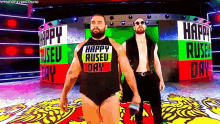 two wrestlers wearing shirts that say happy rused day