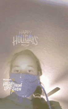 a girl wearing a purple mask says happy holidays