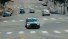 a car is driving down a city street in a blurry photo .