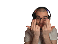 a man wearing headphones and glasses is making a middle finger gesture