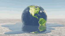 a globe is melting into a puddle of water on the ground