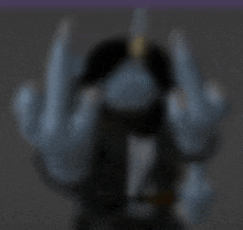 a blurry picture of a person giving a middle finger .