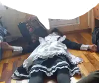 a maid laying on the floor with a speech bubble above her head