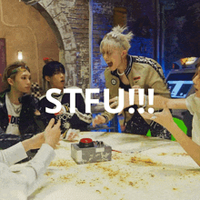 a group of people are playing a game and the word stfu is on the bottom