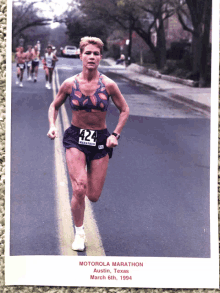 a photo of a woman running the motorola marathon in austin texas on march 6th 1994