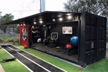 a gym in a shipping container that says biker on the side