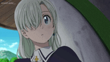 a girl with white hair and a cross on her ear is on a screen that says shahid anime