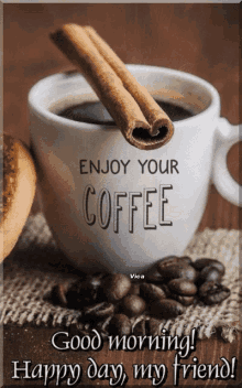 a cup of coffee with cinnamon sticks and the words " enjoy your coffee " on it