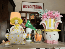 a no loitering sign hangs above a table with easter decorations