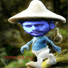 a picture of a smurf with the words karma aka ayu written below it