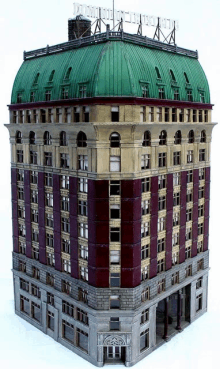 a model of a building with a green dome roof and a sign on top that says ' intercontinental '