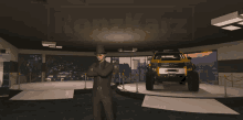 a man in a top hat is standing in front of a yellow toyota truck