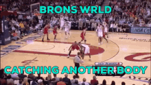 a basketball game is being played with the words brons wrld catching another body below it