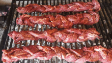 a grill with a bunch of meat on it