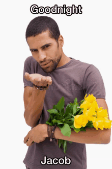 a man blowing a kiss while holding a bouquet of yellow flowers with the name jacob below him