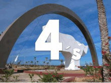 a statue with the number 4 on it in front of a blue sky