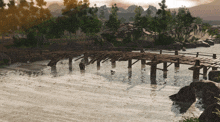 a wooden bridge over a body of water with trees in the background