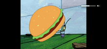 a cartoon character with a huge hamburger on his back