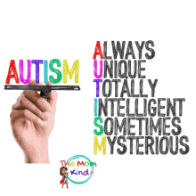 a hand is writing the word autism on a piece of paper