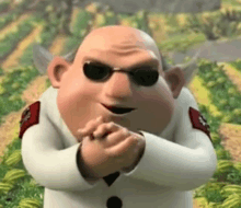 a cartoon character wearing sunglasses and a white suit is standing in a field with his hands folded .